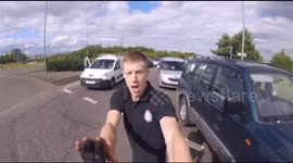 Driver and biker have furious bust-up at roundabout