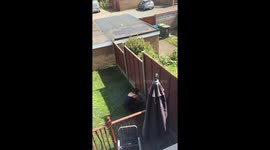 wife cuts grass with scissors