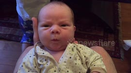 Newborn seemingly smiling randomly at nothing in particular