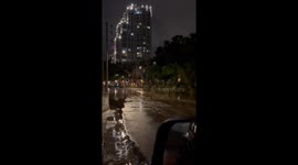 Drivers negotiate flooded streets amid heavy rain in Florida