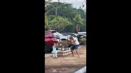 Grandfather makes wacky poses while granddaughter takes his pictures