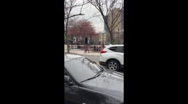 Man Rides Bike While Balancing a Fridge on His Head