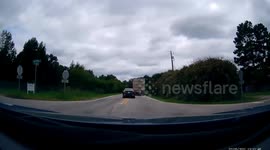 Driver Attempts Passing Truck on Blind Corner