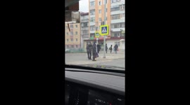 Man With Toy Dog at Crosswalk