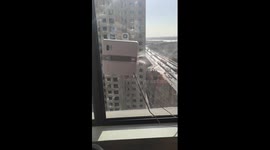 Window-cleaning robot tackles glass in apartment in China