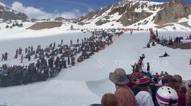 Skier and Inflatable Friends Compete In Pond Skim