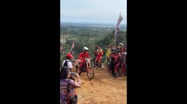 Biker falls on steep slope in Central Java and gets hit by tumbling bike