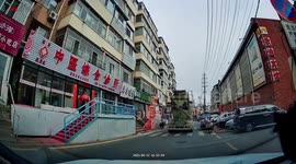 Mixer truck tire bursts and startles roadside vendor in Jilin, China