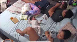 Baby screams for attention while parents are on phones in Quezon, Philippines