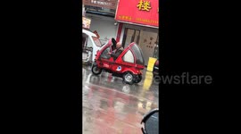 Elderly man drives beetle-shaped convertible leaving onlookers fascinated