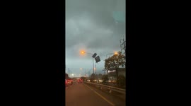 Violent winds send roof crashing into power poles causing explosions
