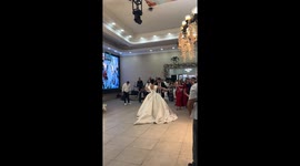 First dance fail as bride falls over her own dress during wedding