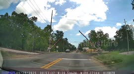 Car Crosses Tracks Before Passing Train
