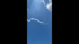 Plane flies above homemade rocket fired from Thai festival