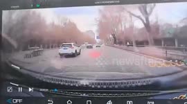 Car flicks up manhole cover sending it flying into car travelling behind