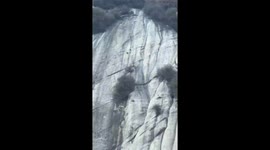 Wild goat seen navigating 400ft cliff face in China