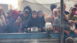 Hundreds crowd for hours as hot meals distributed in southern Gaza amid food crisis