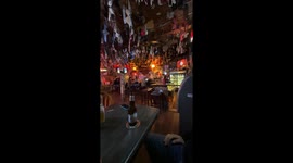Man and Dog Sitting Belly Up at the Bar