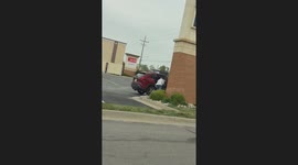 Lady Takes Rocks From Parking Lot