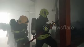 Firemen tackle blaze at school in Thailand