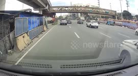 Taxi seen carrying scooter by hanging it from the boot