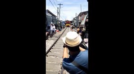 Hapless tourist clipped by train while taking selfie at railway market