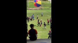 Pupils have fun on sports day playing with giant volleyball