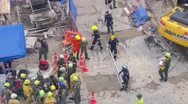 Rescue teams battle to save worker trapped under collapsed subway train construction in Bangkok