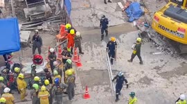 Rescue teams battle to save worker trapped under collapsed subway train construction in Bangkok