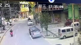Giant boulder crashes down mountain and narrowly misses biker before slamming into building
