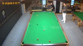 Billiard ball flies into pocket during game in Guangdong, China