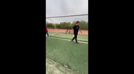 Father accidentally kicks football into son's face in Inner Mongolia, China
