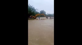 Driver and passengers trapped in submerged truck rescued