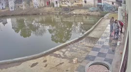 Girl crashes electric bike into fishing pond as family come to her rescue