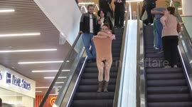 Girl takes off her dress on an escalator (unedited prank)