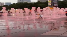 Curious toddler sprayed in the face by fountain hidden under traffic cone