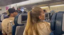 SWAT team board plane and arrest man after