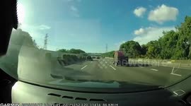 Wreaths fall from the back of truck on motorway