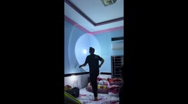 Resident uses badminton racket to catch gecko inside home