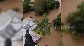 Australia: Woman stranded in flooded home rescued by helicopter crew in Australia