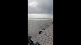 Waterspout appears off Indonesian coast amid low tide