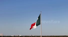 The Mexican national flag waves proudly in the wind