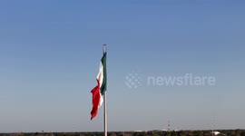 The Mexican national flag waves proudly in the wind