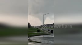 Tornado tears across horizon as storms hit Alabama