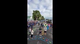 Pupils sing the Philippines' national anthem for school event in New Zealand