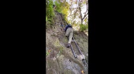 Hiker with one leg successfully negotiates steep steps