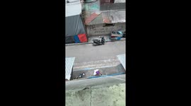 Pensioner shows off pulley he collect parcels with from his second floor apartment