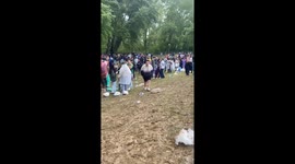 Several men slip and fall on slippery ground in Palencia, Spain