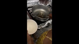 Little girl mistakes lentils for popcorn in La Vega, Dominican Republic