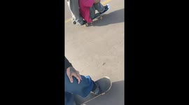 Two men fall off skateboard during downhill ride in São Jerônimo, Brazil